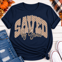 Load image into Gallery viewer, Saved by Grace faith graphic apparel with polka dot lettering, available in brown, navy and black V-neck, long sleeve, crewneck and hoodie styles.
