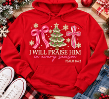 Load image into Gallery viewer, Christian Christmas shirt featuring I Will Praise Him in Every Season Psalm 146:2 graphic with pink bows, decorated Christmas tree, and cream snowflakes.
