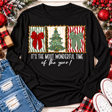 Load image into Gallery viewer, Black long sleeve Christmas graphic shirt featuring vintage-inspired red and green bows, Christmas tree and festive holiday saying.
