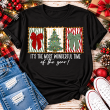 Load image into Gallery viewer, Black short sleeve Christmas graphic tee with red and green bows, decorated Christmas tree and Most Wonderful Time of the Year design.
