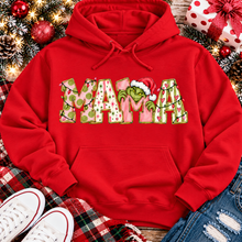 Load image into Gallery viewer, Christmas MAMA graphic shirt featuring pink and green patterned lettering, colorful holiday lights, and a Grinch-inspired character wearing a Santa hat.
