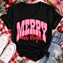 Load image into Gallery viewer, Merry and Bright Christmas graphic apparel with oversized pink polka dot lettering and festive holiday design
