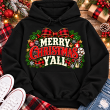 Load image into Gallery viewer, Merry Christmas Y'all graphic apparel featuring vintage red, green, and cream lettering with a festive buffalo plaid bow, Christmas ornaments, pine greenery, and rustic holiday decorations. Southern Christmas graphic available in two colors and four styles, including short sleeve crewneck, V-neck, long sleeve, and hoodie.
