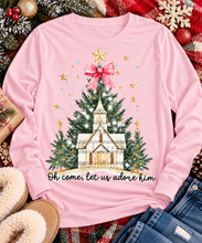 Load image into Gallery viewer, Oh Come Let Us Adore Him Christian Christmas graphic apparel with church, Christmas trees, stars and pink bow
