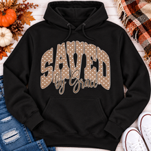 Load image into Gallery viewer, Saved by Grace faith graphic apparel with polka dot lettering, available in brown, navy and black V-neck, long sleeve, crewneck and hoodie styles.
