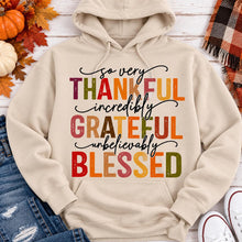 Load image into Gallery viewer, Thankful Grateful Blessed fall graphic hoodie with colorful autumn lettering
