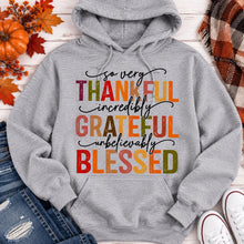 Load image into Gallery viewer, Thankful Grateful Blessed fall graphic hoodie with colorful autumn lettering
