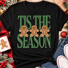 Load image into Gallery viewer, Tis the Season Christmas graphic apparel featuring green polka dot lettering and three gingerbread cookies
