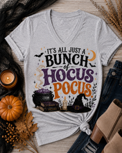 Load image into Gallery viewer, Gray Halloween graphic tee with It’s All Just a Bunch of Hocus Pocus lettering, cauldron, spell books, witch hat and bats.
