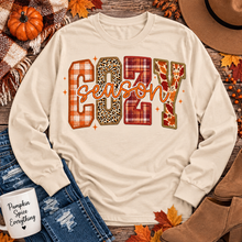 Load image into Gallery viewer, Cream long sleeve Cozy Season fall graphic shirt with mixed plaid, leopard and autumn patterns
