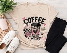 Load image into Gallery viewer, Cream Coffee My Love Language graphic tee featuring a pink and leopard print coffee cup, black checkerboard pattern, hearts, stars and Strong Coffee Positive Mind Good Vibes text.

